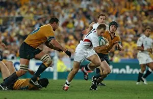 2003 Rugby World Cup Final Collection: Mike Catt makes a break during the 2003 World Cup Final