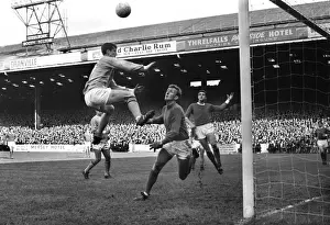 Mike Doyle jumps for a header in the 1967 / 8 Manchester derby at Maine Road