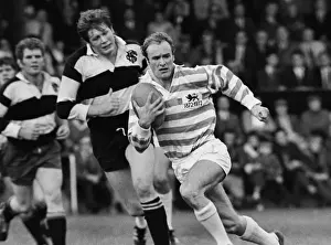 Mike Gibson runs with the ball for a Cambridge University Past and Present side in 1972