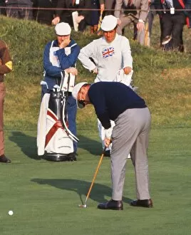 Golf Collection: Miller Barber putts during the 1969 Ryder Cup