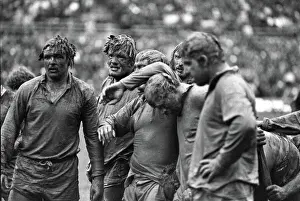Mud-covered British Lions forwards face the Junior All Blacks in 1977