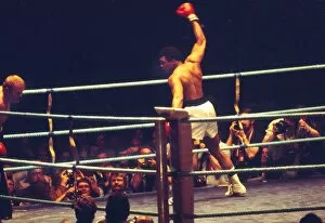 Images Dated 17th February 2011: Muhammad Ali show off to the crowd as he knocks down Richard Dunn