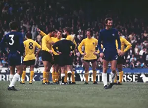 Peter Osgood laughs as Ipswich players appeal to the referee