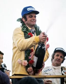 Images Dated 5th July 2011: Peter Revson celebrates after winning the 1973 British Grand Prix