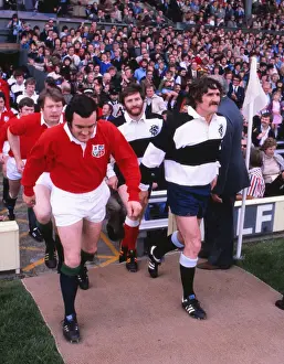 Phil Bennett leads out the British Lions while his Welsh teammate Gerald Davies captains the Barbarians in the 1977 Silver Jubilee Match