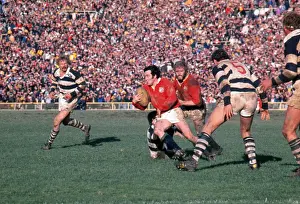 Phil Bennett makes a break for the Lions on the way to scoring a try against Auckland in 1977
