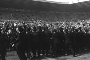 Images Dated 3rd June 2008: Police try to stop Manchester United fans invading the Old Trafford pitch after Denis Laws goal