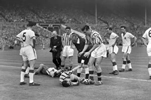 Soccer Collection: Ray Wood and Peter McParland go down injured in the 1957 FA Cup Final
