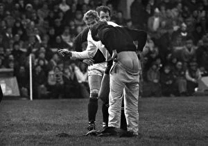 Images Dated 19th February 1983: Referee Roger Quittenton askes a streaker to pull his trouser up - 1983 Five Nations
