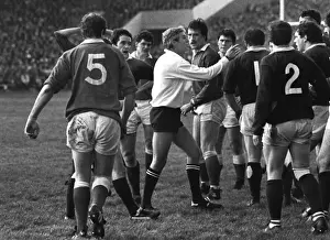 Referee Roger Quittenton steps-in to stop the Scottish and Welsh forwards fighting - 1983 Five Nations