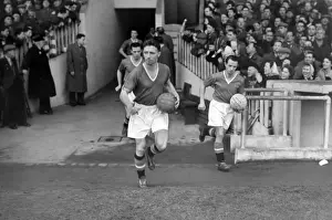 Roger Byrne leads Manchester United out at Old Trafford in 1955