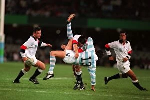Images Dated 9th September 2011: Rory Underwood puts in a big tackle at the 1995 Rugby World Cup