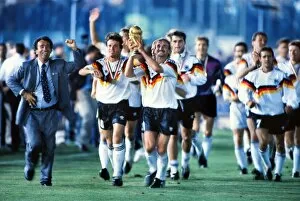 Images Dated 12th May 2010: Rudi Voller celebrates with the World Cup trophy in 1990