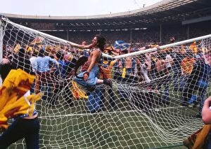 Images Dated 4th June 1977: Scotland fans bring down the goalpost at Wembley - 1977 British Home Championship