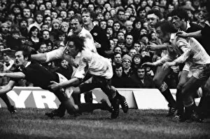 Images Dated 24th March 2011: Scotlands Alan Lawson passes under pressure from Englands Nigel Horton - 1977 Five Nations