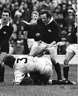 Scotlands Alastair McHarg and Chris Rea stand over Englands Fran Cotton - 1971 Five Nations