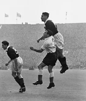 Images Dated 9th August 2013: Scotlands Billy Liddell out-jumps Englands Alf Ramsey - 1952 / 3 British Home Championship