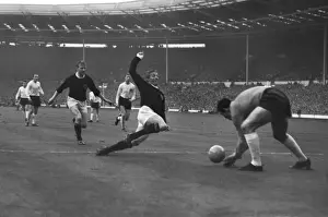 Scotlands Denis Law moves in to challenge England goalkeeper Gordon Banks
