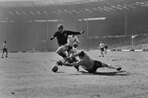 Scotlands Denis Law rounds Englands goalkeeper Gordon Banks to score at Wembley in 1965