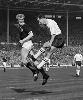 Images Dated 6th December 2010: Scotlands Ian Ure and Englands Bryan Douglas jump for the ball - 1963 British Home Championship