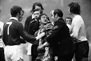A Scottish fan is removed from the Wembley pitch after attacking Alan Ball - 1973 British Home Championship