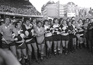 The two sides link hands at the end of the match after the Barbarians defeat the Australians in 1976
