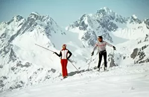 Images Dated 9th May 2012: Two Skiers admire the view from a mountain top