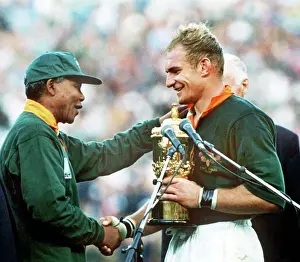 South Africa captain Francois Pienaar receives the World Cup from Nelson Mandela in 1995
