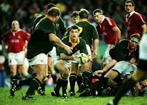 Images Dated 15th September 2010: South Africas Joost van der Westhuizen passes the ball out against the British Lions in 1997