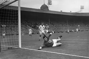 FA Cup Winners Collection: Stand-in goalkeeper Jackie Blanchflower makes a save during the 1957 FA Cup Final