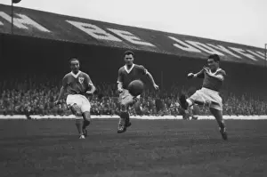 Stanley Matthews competes with John Bramwell and Bobby Collins for the ball in 1958