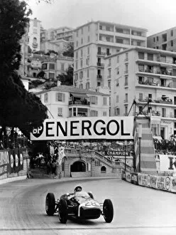 Motorsport Collection: Stirling Moss on the way to winning the 1960 Monaco Grand Prix in his Lotus Climax +