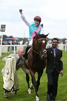 Images Dated 19th June 2012: Tom Queally celebrates winning the Queen Anne Stakes on Frankel