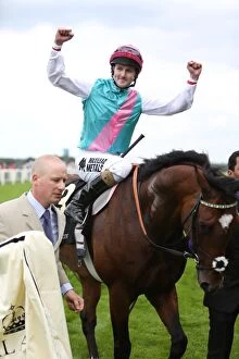 Images Dated 19th June 2012: Tom Queally celebrates winning the Queen Anne Stakes on Frankel