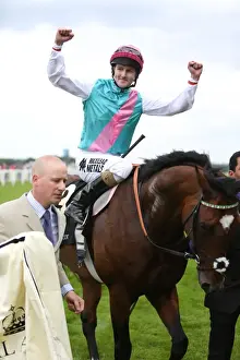 Tom Queally celebrates winning the Queen Anne Stakes on Frankel