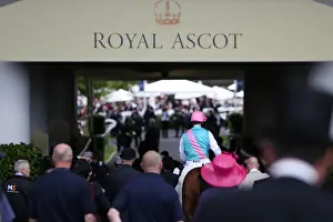 Tom Queally and Frankel leave the course to go to the parade ground after winning the Queen Anne Stakes