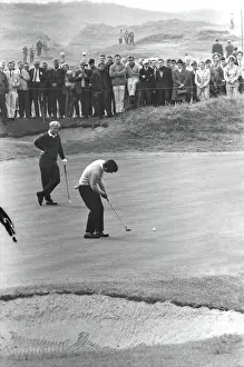 Tony Jacklin putts while Jack Nicklaus looks on during their famous 1969 Ryder Cup singles match