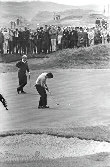 1969 Ryder Cup Collection: Tony Jacklin putts while Jack Nicklaus looks on during their famous 1969 Ryder Cup singles match