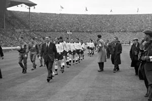 1961 FA Cup Final - Tottenham Hotspur 2 Leicester City 0 Collection: Tottenham Hotspur manager Bill Nicholson leads his Tottenham team onto the pitch for the 1961 FA