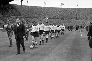 1961 FA Cup Final - Tottenham Hotspur 2 Leicester City 0 Collection: Tottenham Hotspur manager Bill Nicholson leads his Tottenham team onto the pitch for the 1961 FA