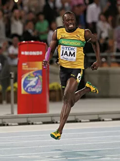 Images Dated 4th September 2011: Usain Bolt anchors Jamaica to World Championship relay gold & a new WR