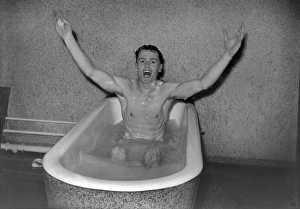 Villa captain Johnny Dixon celebrates in the Wembley baths after the 1957 FA Cup Final