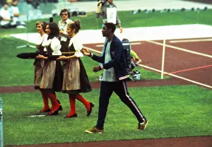 Vince Matthews casually swings his 400m Olympic gold medal after the ceremony in 1972