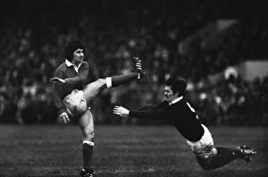 Images Dated 29th July 2011: Wales Gareth Davies kicks under pressure from Alan Lawson - 1979 Five Nations