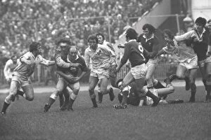 Images Dated 11th February 2009: Wales Terry Cobner is tackled by Roger Uttley - 1975 Five Nations