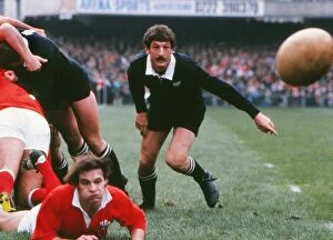 Images Dated 16th September 2010: Wales Terry Holmes gets the ball away against the All Blacks in 1980 under pressure from Graham