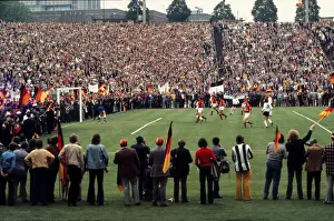Russia Prints: West German fans prepare to invade the pitch in the final moments of Euro 72