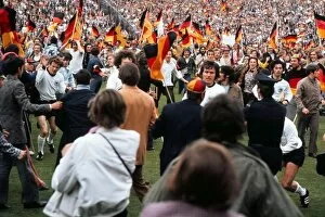 Euro 1972 Collection: West German players run of the field as fans invade the pitch after victory in Euro 72