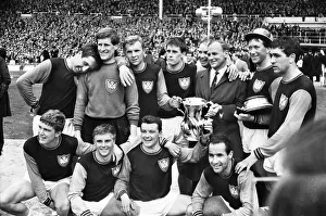 West Ham manager Ron Greenwood celebrates victory with his players after the 1964 FA Cup Final