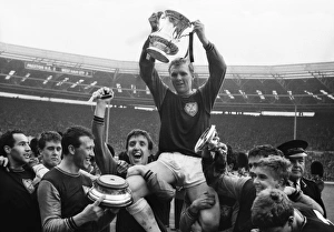 West Ham United captain Bobby Moore is chaired on his teammates shoulders after victory in the 1964 FA Cup